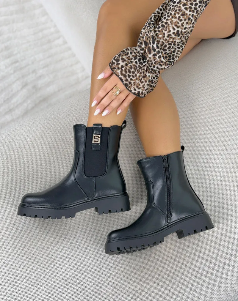 Bottines femme noires tendance à semelle crantée et détail doré