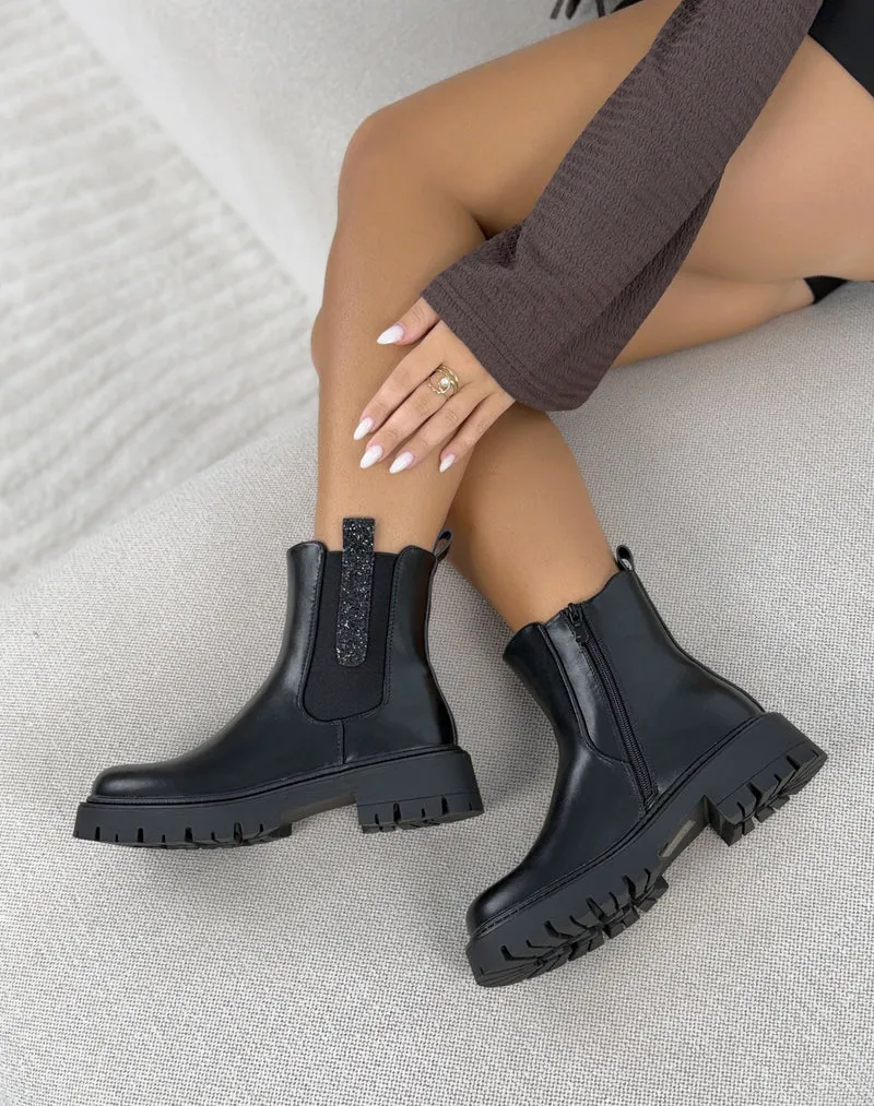 Bottines femme noires tendance à semelle crantée et tirettes pailletées
