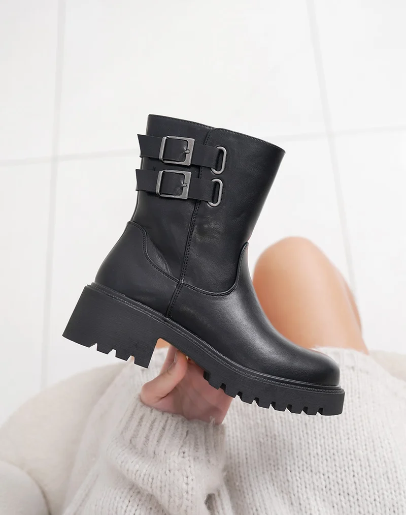 Bottines noires hautes à doubles sangles et semelle crantée