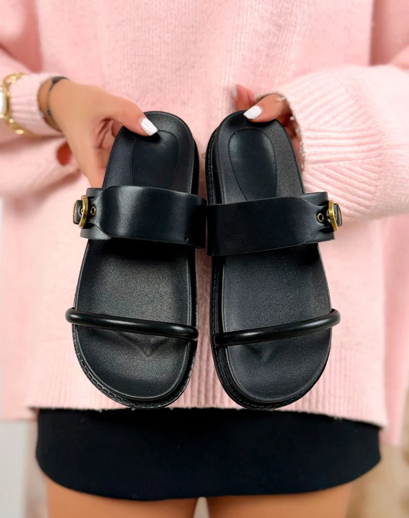 Mules noires à bride avec boucle dorée