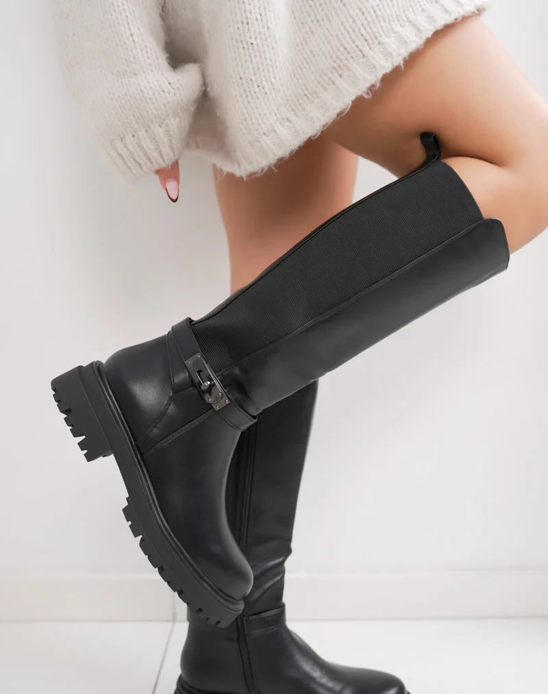 Bottes femme noires fourrées à semelle crantée, élastiquées avec sangle boucle cadenas