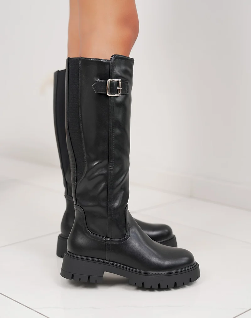Bottes noires à semelle crantée et boucle argentée