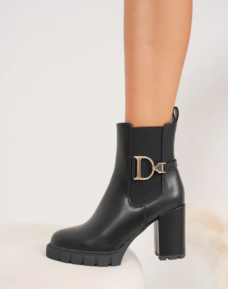 Bottines femme noires style Chelsea à talons hauts avec détail doré et semelle crantée