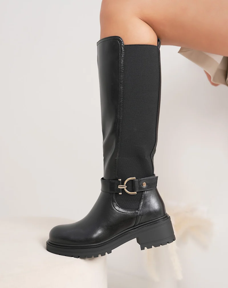 Bottes femme noires style chevalière avec bande élastique et bijou doré