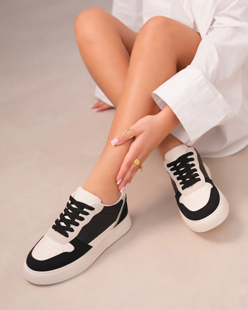 Basket femme blanche et noire avec détails léopard et paillettes