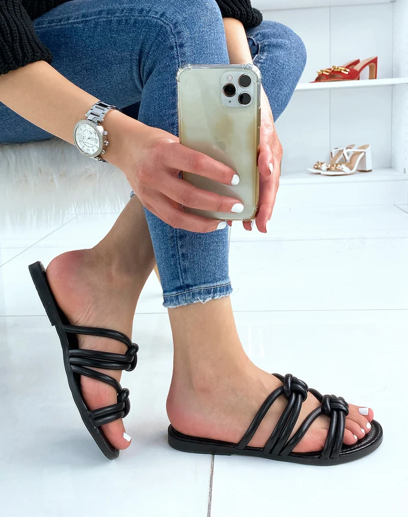 Mules plates noires à brides entrecroisées