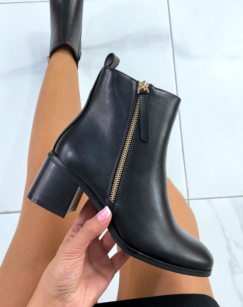 Bottines noires à zip doré et petit talon