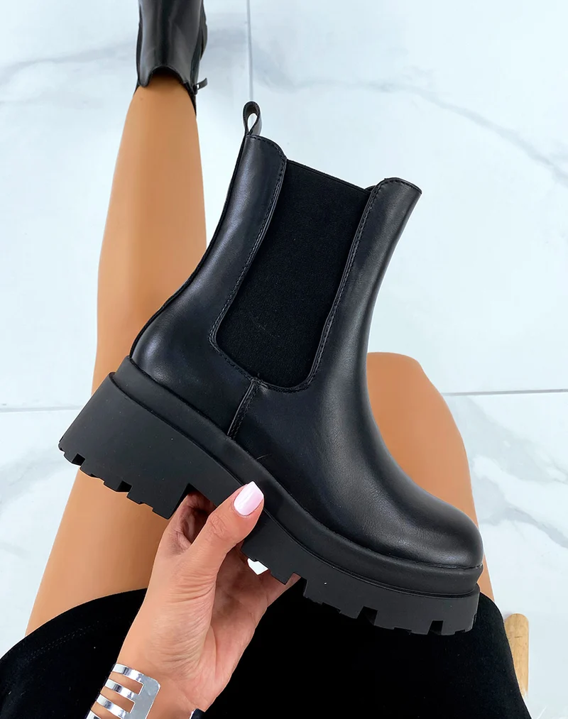 Chelsea boots noires montantes à talon et semelle crantée