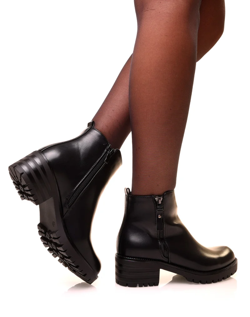 Bottines noires à fermeture décorative et semelle crantée