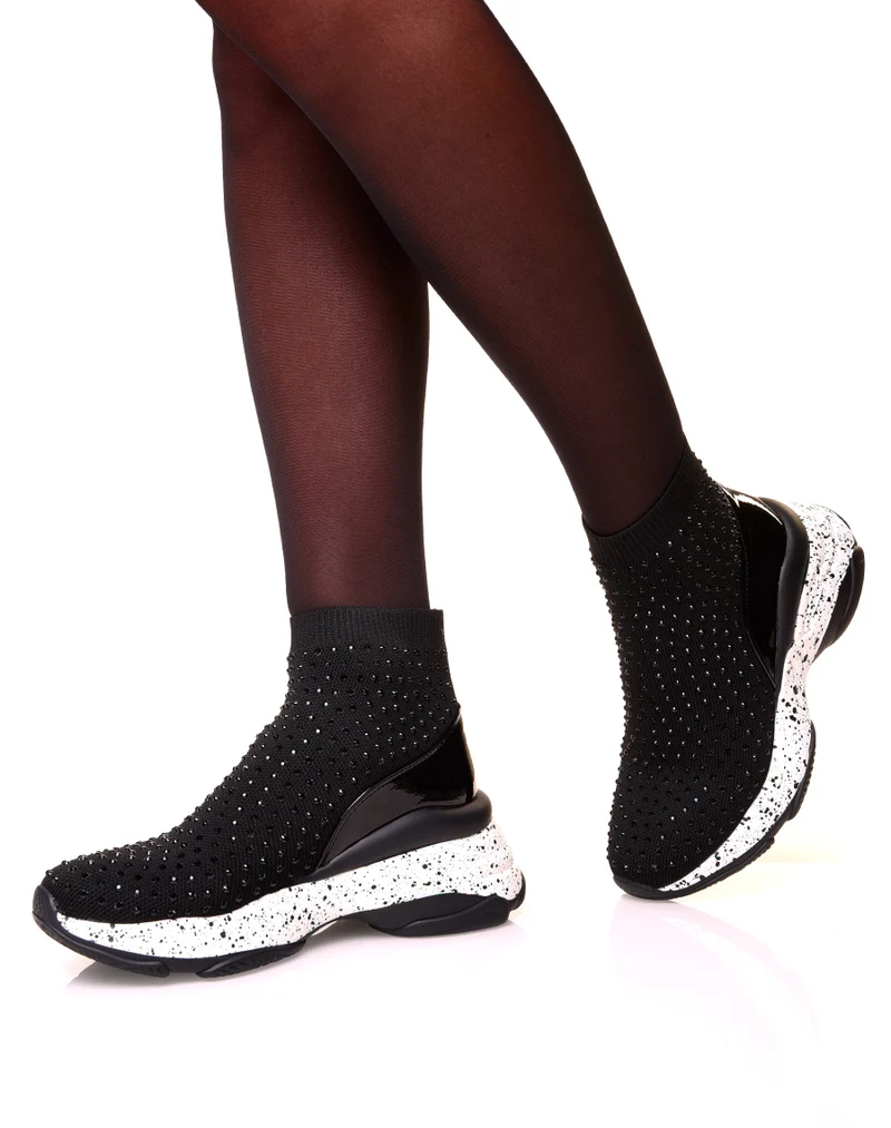 Baskets noires en forme de chaussette à semelles tachetées
