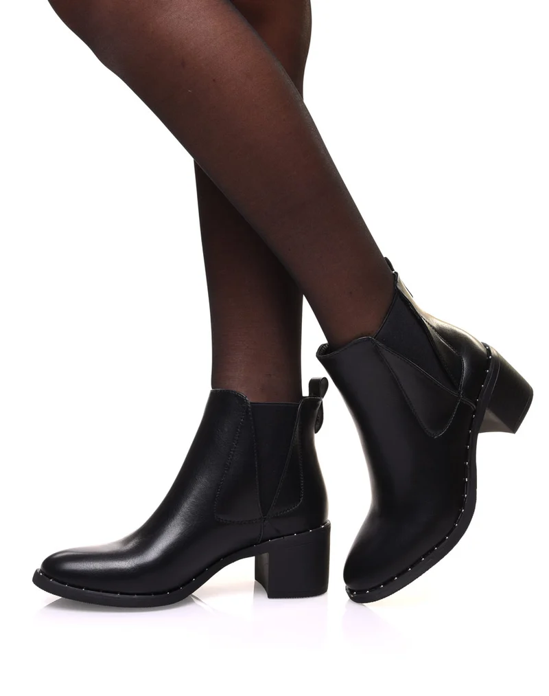 Bottines noires à élastiques échancrés et talon mi haut