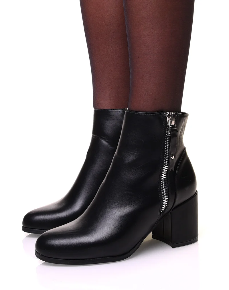 Bottines noires à talon et fermeture argentée sur le côté