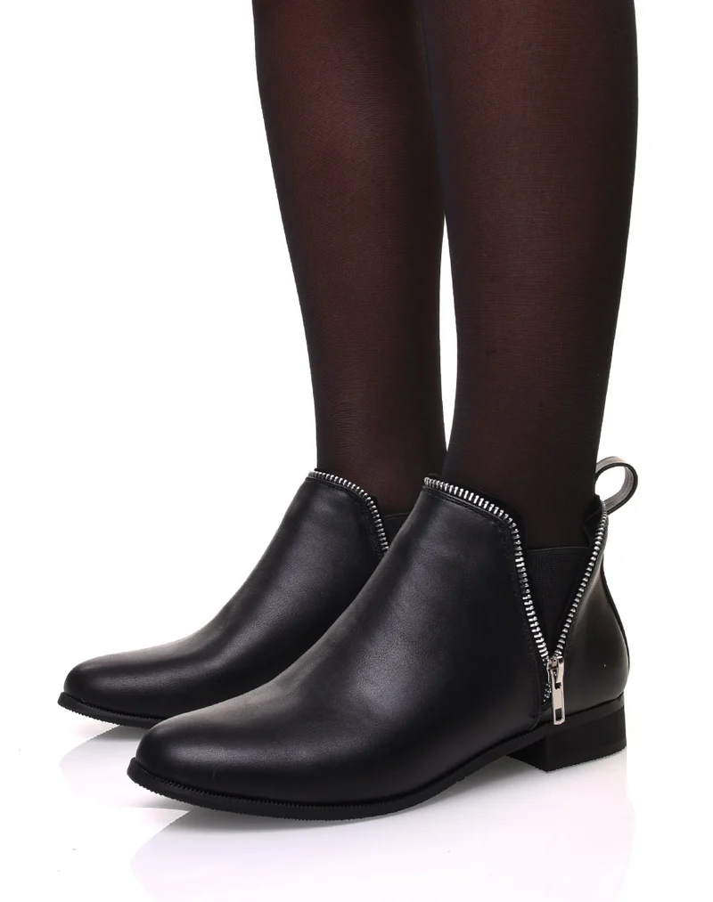 Chelsea boots noirs avec détails fermeture éclaire