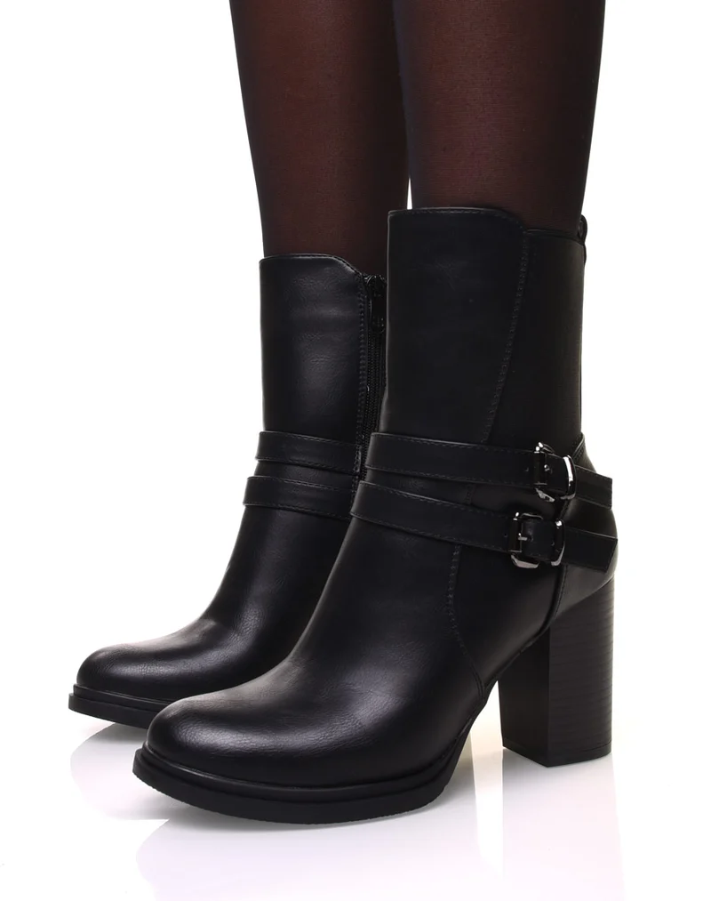 Bottines noires montantes à talons à sangles