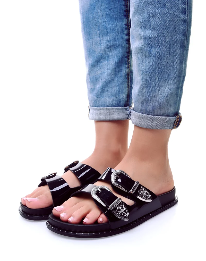 Mules noires à boucles argent