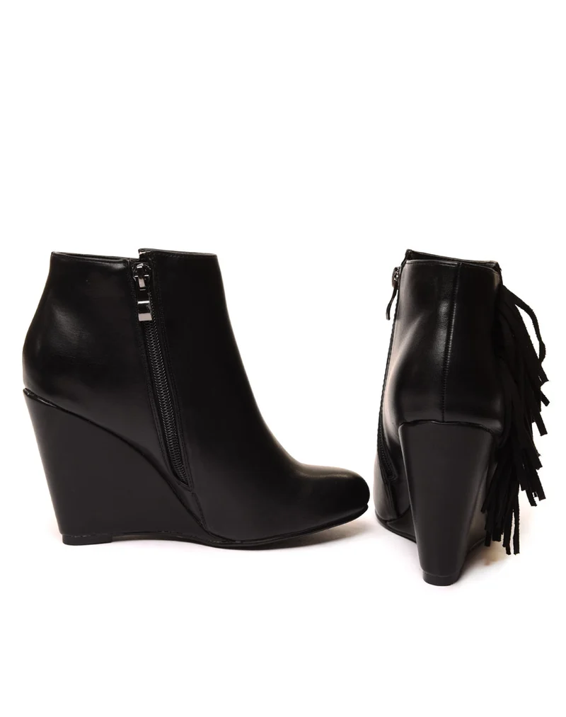 Bottines compensées noires à franges en suédine