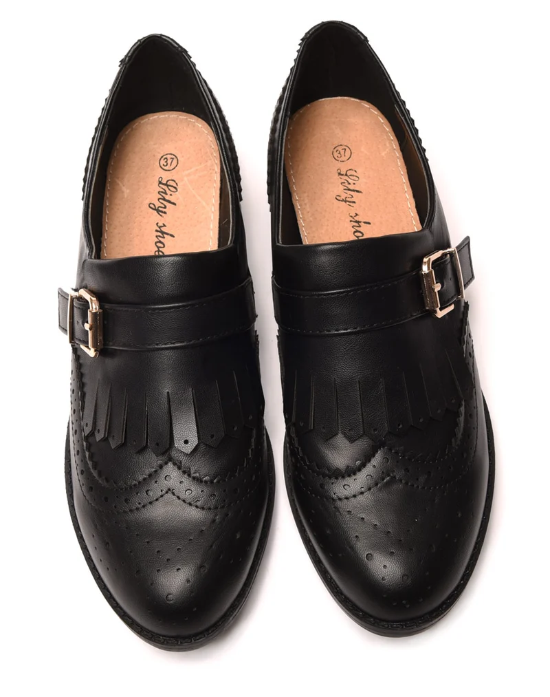 Derbies noires à sangle et franges